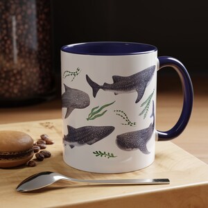 Watercolor whales sharks swimming with seaweed around covering all around the mug