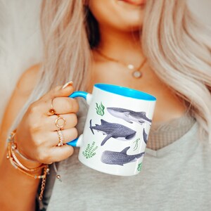 Watercolor whales sharks swimming with seaweed around covering all around the mug