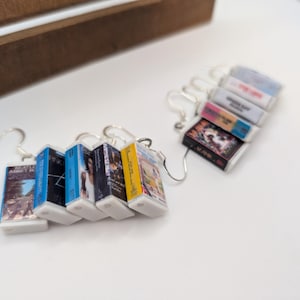 a couple of books are hanging from a hook