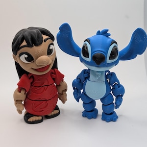 May include: A blue and white Stitch figurine and a red and black Lilo figurine. Both figurines are 3D printed and have a textured surface.