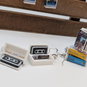 a couple of key chains sitting on top of a table