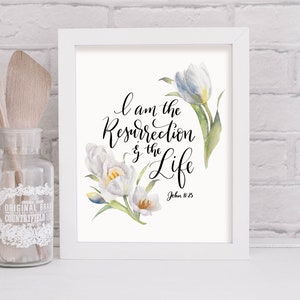 May include: White framed print with a watercolor illustration of white tulips and the text "I am the resurrection and the life, John 11:25".