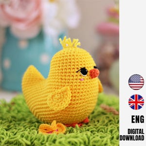 May include: A handmade, yellow crochet chick with black eyes, an orange beak, and small wings. The chick is sitting on green yarn, with a small flower nearby. The image includes the text "ENG DIGITAL DOWNLOAD" and the American and British flags.