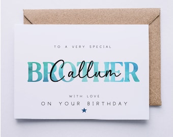 May include: A white card with blue watercolor text that reads "To a very special Brother Callum with love on your birthday". A small blue star is below the text. The card is on top of a brown envelope.