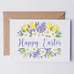May include: A white card with a floral design of yellow tulips, white daffodils, and purple hyacinths. The text "Happy Easter" is printed in a purple font.
