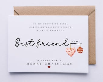 May include: A white Christmas card with red and white ornaments and a red heart. The card reads "To my beautiful, kind, caring, intelligent, strong & truly fabulous Best friend Chloe Wishing you a Merry Christmas".