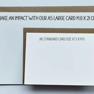 May include: Two white cards with brown borders. The larger card has the text "MAKE AN IMPACT WITH OUR A5 LARGE CARD 14.8 X 21 CM". The smaller card has the text "A6 STANDARD CARD SIZE 10.5 X 14.8".
