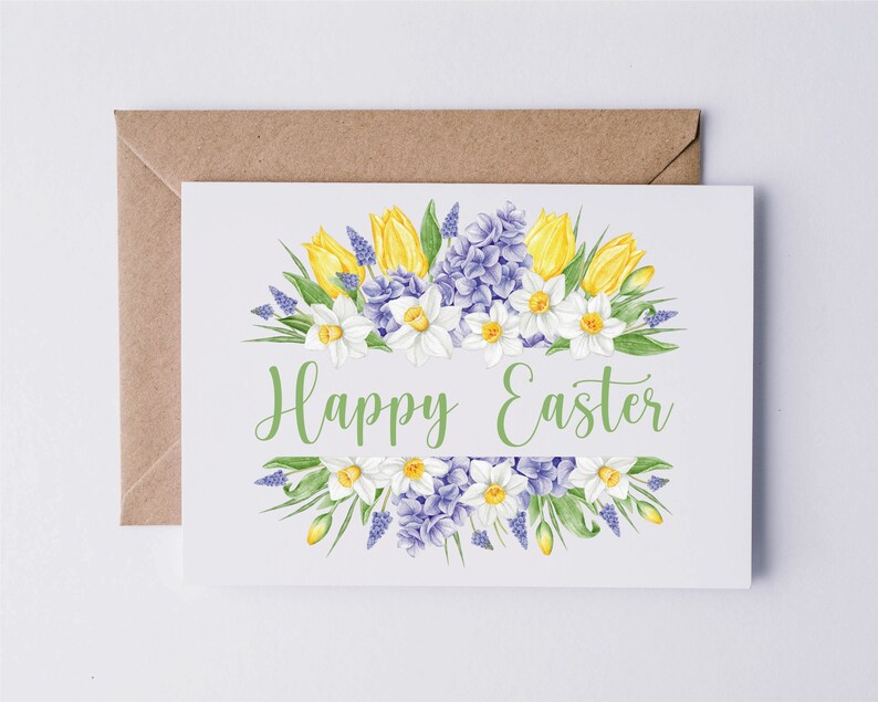 May include: A white card with a floral design of yellow tulips, white daffodils, and purple hyacinths. The text "Happy Easter" is written in green lettering.