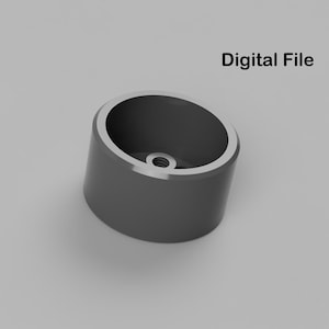 May include: A gray plastic 3D printed cylinder with a small hole in the center.