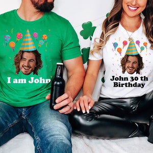 a man and a woman sitting on a bed
