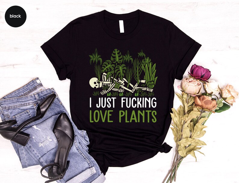 May include: Black t-shirt with a skeleton surrounded by plants and the text "I just fucking love plants".