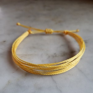 Happy Bracelet Adjustable Multi-strand Bracelet With Yellow Strings