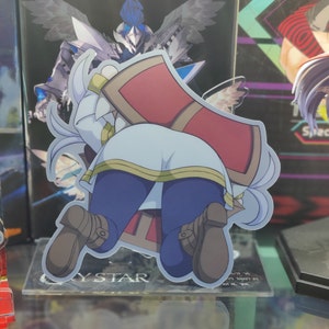 May include: A white and blue anime character figurine with a red and gold cape. The character is standing on a clear acrylic base with the text "My Star" printed on it.