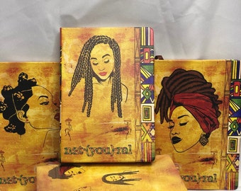 May include: A stack of six yellow journals with colorful geometric patterns and illustrations of women with different hairstyles. The text "nat(you)ral" is printed on the front cover of the top journal.