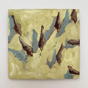 May include: An abstract oil painting on canvas. The artwork features a textured background in shades of yellow and green. Dark brown and blue shapes are painted throughout the canvas, creating a sense of depth and movement. The brushstrokes are visible, adding to the artwork's tactile quality.