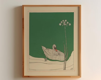 May include: A framed print of a stylized illustration of a duck on a green background. The duck is white with black outlines and is resting on a white surface. The print is in a wooden frame.