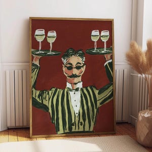 May include: A framed painting depicts a waiter in a striped jacket holding two trays with wine glasses. The background is a deep red, and the waiter has a mustache and sunglasses. The artwork is in a wooden frame.