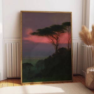 May include: A framed art print depicting a sunset with a vivid pink and purple sky. The silhouette of trees and a dark hillside are set against the colourful sky. The artwork is presented in a wooden frame.
