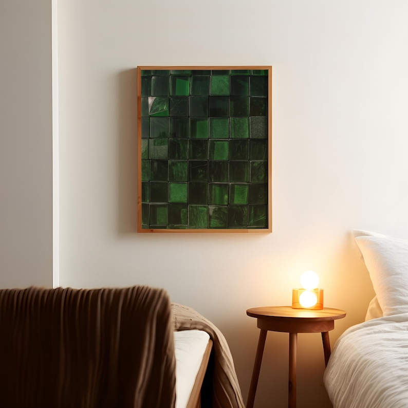 May include: A framed wall art piece featuring a grid of dark green, textured squares. The artwork is encased in a light brown wooden frame and hangs on a white wall. The piece adds a modern touch to the room's decor.