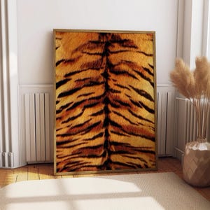 May include: A rectangular wall art print featuring a high-resolution close-up of orange and black tiger fur patterns. The print is encased in a thin, light-toned wooden frame, displaying a vertical orientation with a repeating striped design.