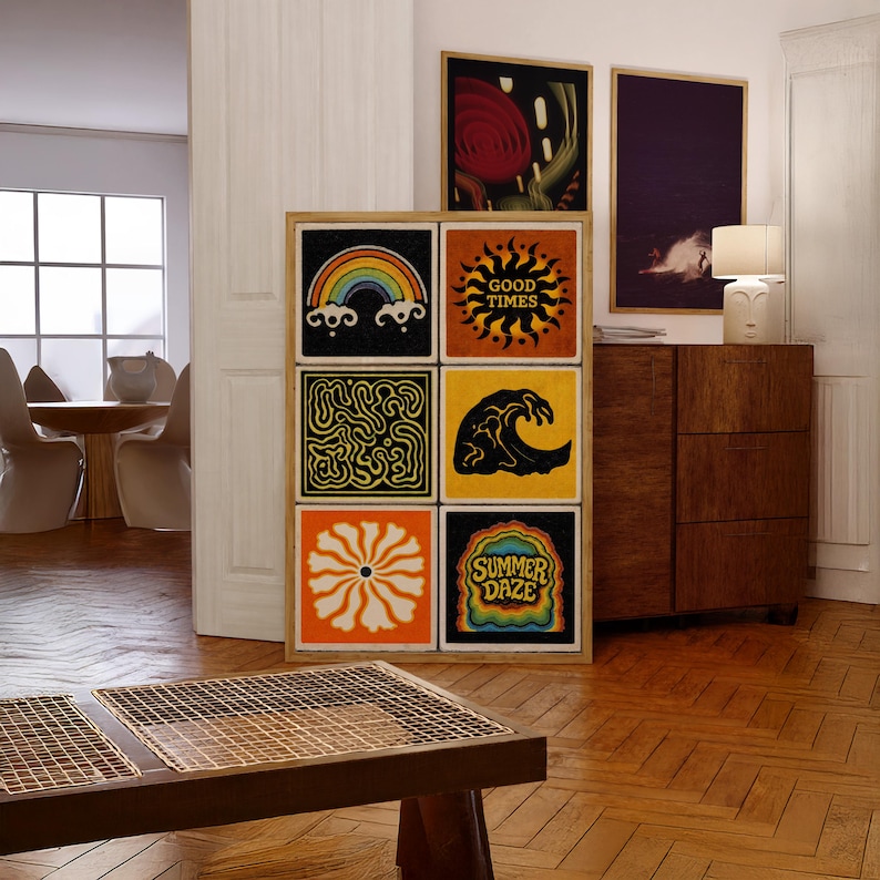 May include: A wooden framed art piece featuring six square panels with colorful, retro-style designs. The panels include a rainbow, sun with "GOOD TIMES" text, abstract patterns, a wave, a flower, and "SUMMER DAZE" text. The artwork is displayed in a room with hardwood floors.