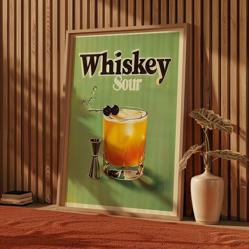 May include: A vintage-style poster with a green background featuring the text "Whiskey Sour" in black lettering. A glass of whiskey sour with maraschino cherries is depicted in the centre of the poster.