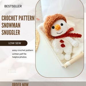 May include: Crochet pattern for a snowman snuggler. The pattern includes easy instructions, a written PDF file, and helpful photos. The snowman is white with a brown hat, red scarf, and orange nose.