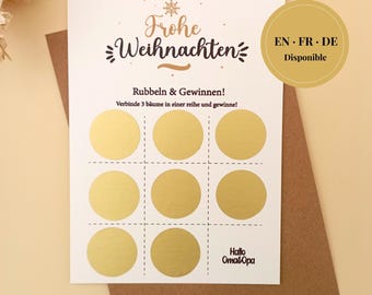 May include: A white scratch-off Christmas card with gold foil circles arranged in a tic-tac-toe grid. The card features the German text "Frohe Weihnachten" and "Rubbeln & Gewinnen!" with a brown envelope. A gold circle indicates availability in English, French, and German.