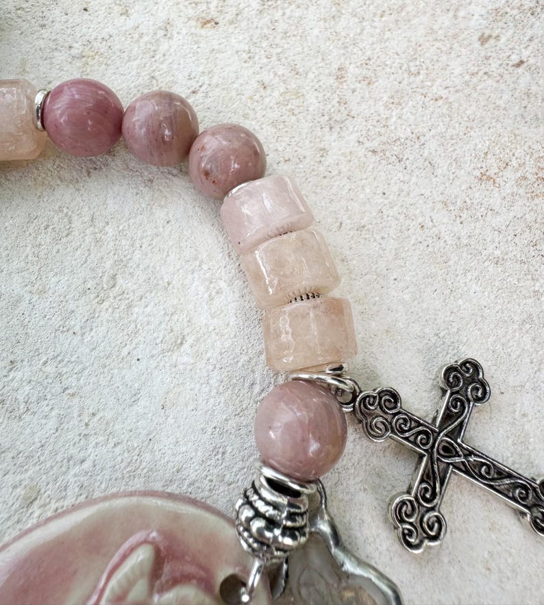 May include: A set of three ceramic mugs with a speckled, matte finish. The mugs are in shades of blue, green, and white. Each mug has a rounded shape and a simple, modern design. The mugs are likely for coffee or tea.