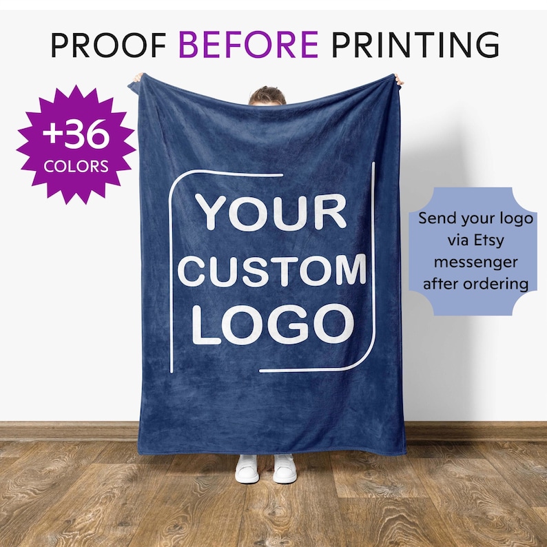 a person holding a blue towel with the words your custom logo printed on it