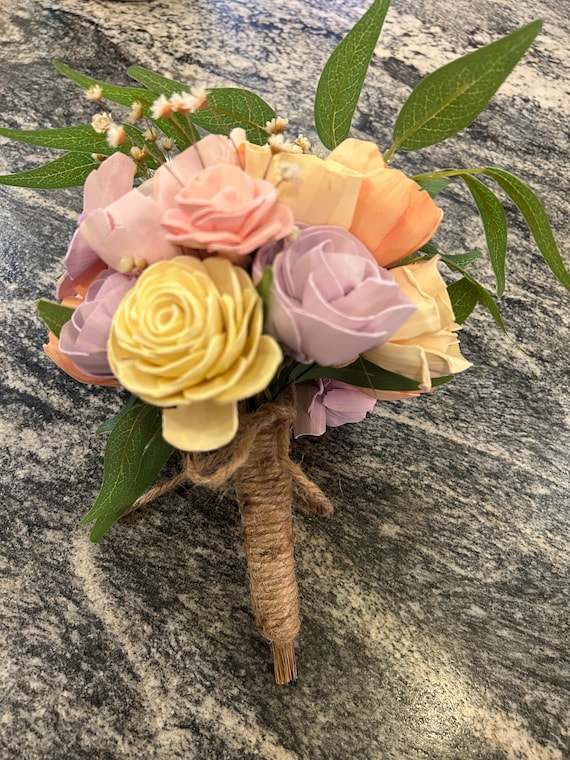 Gorgeous sola wood flower bouquet 8 inches wide by 10 inches high with a raffia / twine wrapped stem