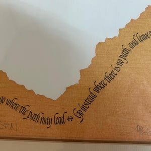 May include: A distressed wooden sign with the words "Welcome to our home" in white. The sign has a rustic finish and a simple design, ideal for a front door.