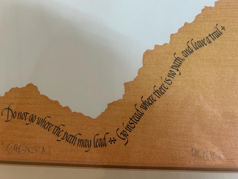 May include: A distressed wooden sign with the words "Welcome to our home" in white. The sign has a rustic finish and a simple design, ideal for a front door.