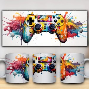 May include: A white ceramic mug with a colourful paint splatter design featuring a video game controller. The controller is yellow, blue, red, green, and purple.