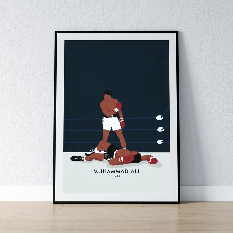 May include: A black and white illustration of boxer Muhammad Ali standing over a fallen opponent in a boxing ring. The text "Muhammad Ali 1964" is below the image.
