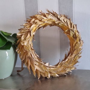 Wreath made of golden feathers / wrapped on both sides / approx. 30-35 cm in diameter