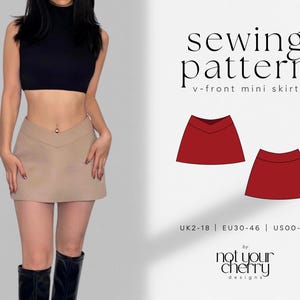 May include: A sewing pattern for a V-front mini skirt featuring text that reads sewing pattern v-front mini skirt, UK2-18, EU30-46, US00-14, and by not your cherry designs. The image displays a beige mini skirt with a V-shaped waistband.