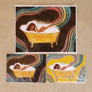 May include: Three prints of a woman relaxing in a yellow bathtub with bubbles. The woman has dark skin and long dark hair. The background is a dark blue with rainbow stripes.
