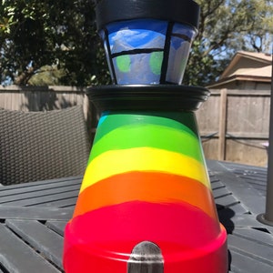 LG lighthouse planter,hand painted,clay pot, decorative pot,UV,glow in the dark acrylic paint,rainbow,blue,whimsical,reiki