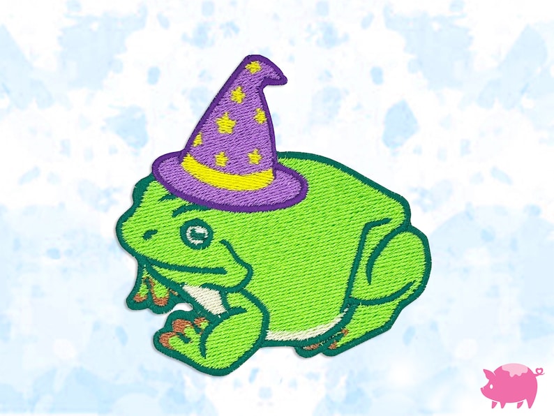 May include: Embroidered patch featuring a green frog wearing a purple wizard hat with yellow stars. The frog has orange feet and a smiling expression. The patch is designed with a stitched texture and a white background.