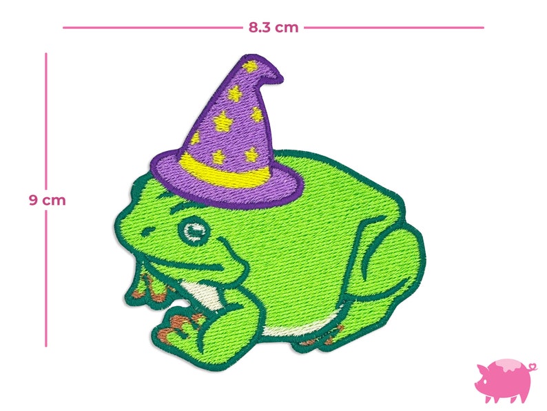 May include: Embroidered patch featuring a green frog wearing a purple wizard hat with yellow stars. The patch measures approximately 3.5 inches wide and 3.5 inches tall. The frog has orange feet and a friendly expression.