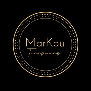 May include: A circular logo with the text "Markou Treasures" in a gold color. The text is inside a gold circle with a dotted border, set against a black background. The logo has a classic and elegant design.
