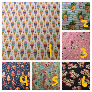 May include: A fabric pattern featuring rows of colorful ice cream cones on a white background. The cones have various pastel-colored scoops, including pink, blue, green, and yellow. The cones are brown, and the overall design is playful and vibrant.