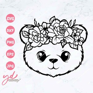 May include: Black and white line art illustration of a bear's face wearing a flower crown. The bear has large eyes and a small nose.