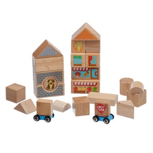 May include: A set of wooden building blocks with colourful illustrations of animals and objects. The blocks are stacked to form two small houses, one with a cat and the other with a dog. There are also additional blocks with different shapes and sizes, including a truck with the words "Lucy & Leo" on it.