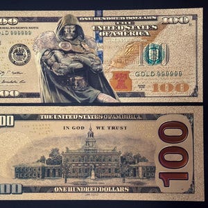 May include: A gold-coloured £100 note featuring a portrait of Doctor Doom from Marvel Comics. The note also includes the words "The United States of America" and "In God We Trust".