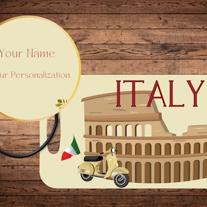May include: A luggage tag with a yellow scooter and the Colosseum in the background. The tag is cream colored with the word "ITALY" in red letters. There is a space for a name and personalization.