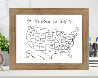 May include: A black and white outline map of the United States with each state labeled. The map is framed in a light brown wood frame. The text "Oh. The Places I've Sold To..." is at the top of the map.