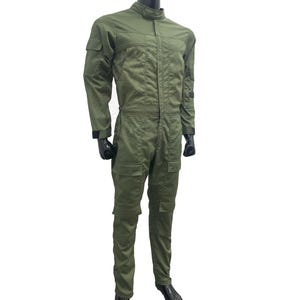 May include: A green utility jumpsuit with a zipper closure and multiple pockets. The jumpsuit has a relaxed fit and is made of a durable fabric.