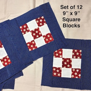 May include: A set of 12 9 inch by 9 inch square blocks featuring a dark blue fabric with white polka dots. Each block contains a central nine-patch square pattern alternating between solid white fabric and red fabric with white stars.